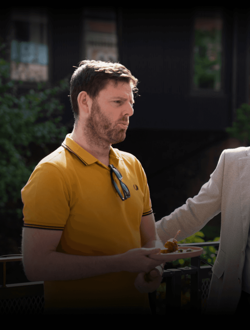 Two directors of Hyperact sitting together looking at the camera.