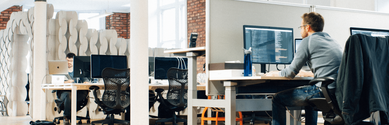 a Capsule member working from their desk in the office