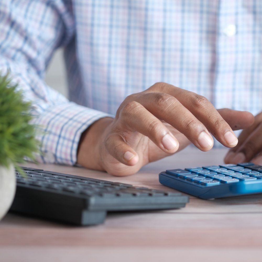 Male using a calculator